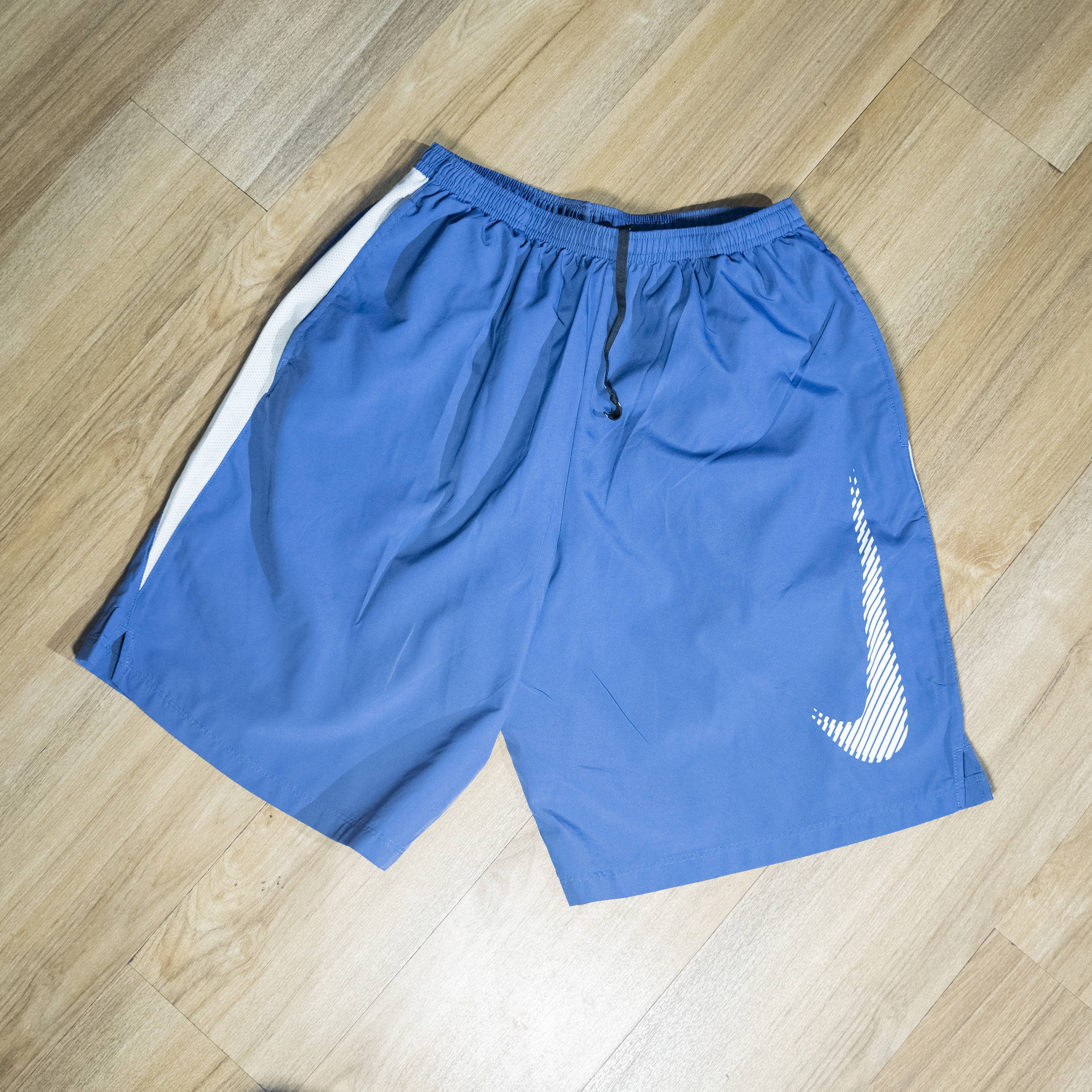 Nike Men's Blue Athletic Shorts with White Swoosh