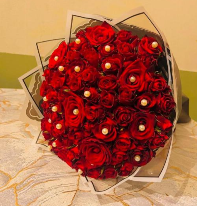 Hand bouquet of red roses